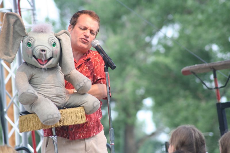 Ventriloquist Joe Gandelman at one of his summer fairs with 